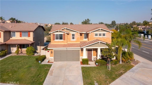 view of front of property with a front lawn and a garage