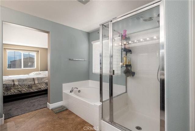 bathroom featuring tile patterned flooring and shower with separate bathtub