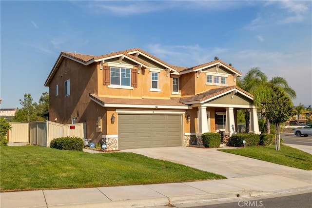 craftsman inspired home with a garage and a front yard