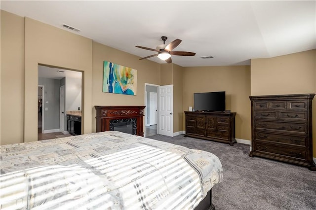 bedroom featuring ceiling fan, carpet floors, and connected bathroom