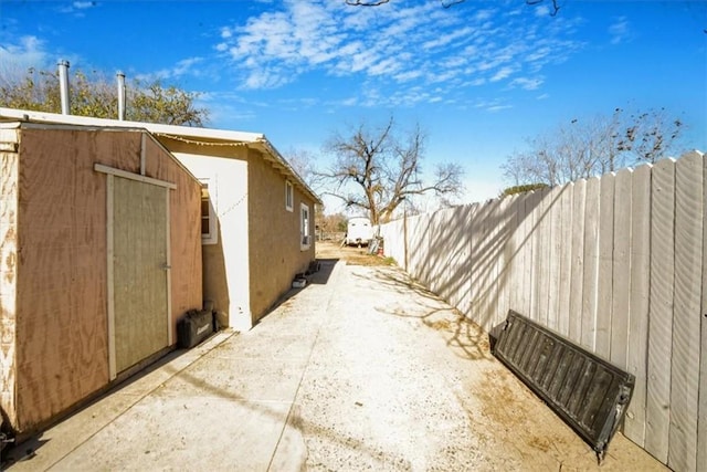 view of home's exterior with a storage shed