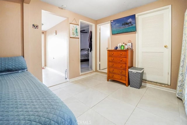 tiled bedroom with a closet