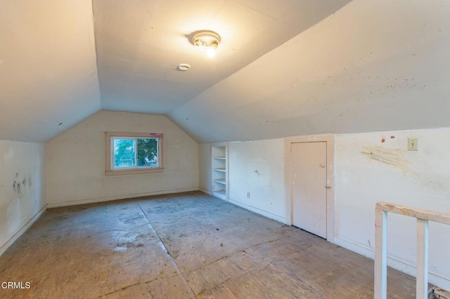 additional living space with lofted ceiling