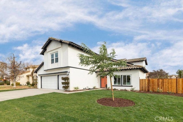 view of front of property featuring a garage and a front lawn