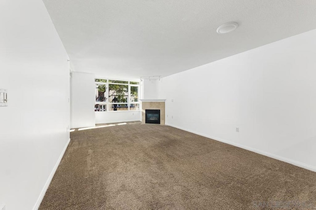 unfurnished living room with carpet flooring