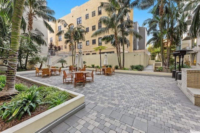 surrounding community featuring a patio area