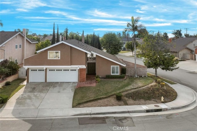 view of front of property with a front lawn and a garage