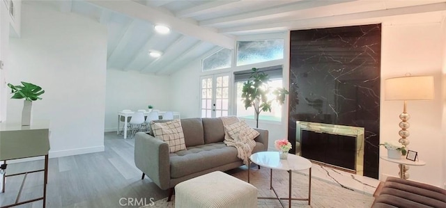 living room with lofted ceiling with beams and wood-type flooring