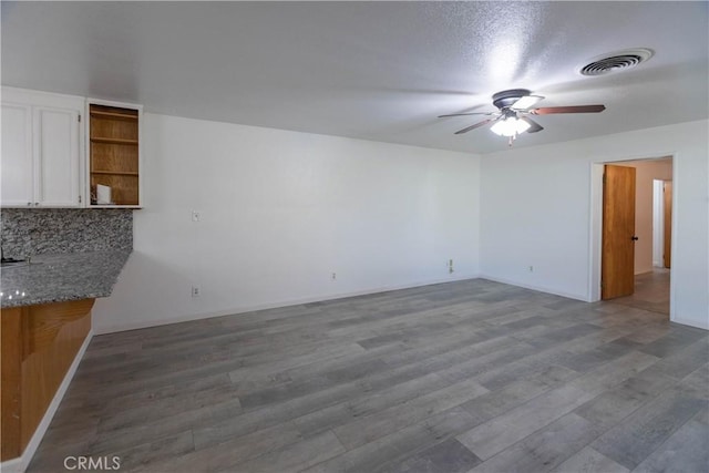 interior space with hardwood / wood-style flooring and ceiling fan