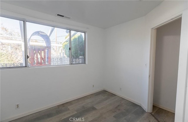 empty room featuring hardwood / wood-style floors