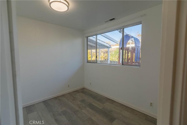 unfurnished room featuring hardwood / wood-style floors