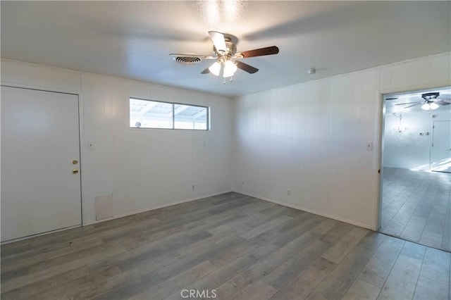 interior space featuring ceiling fan and wood-type flooring