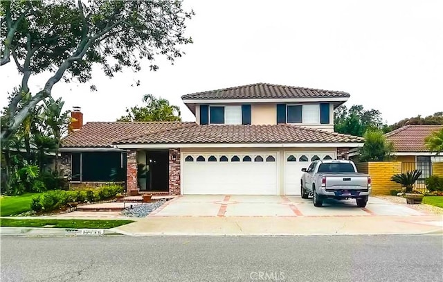 mediterranean / spanish house featuring a garage