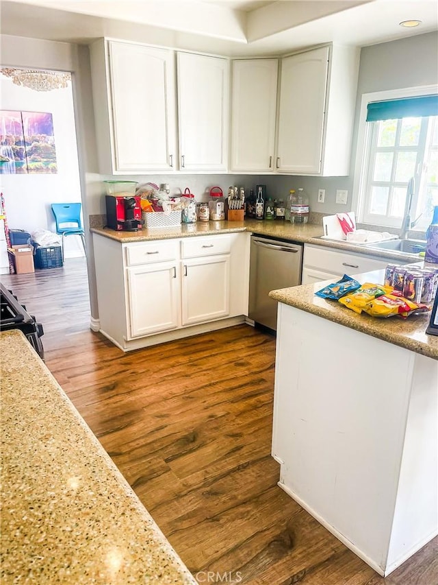 kitchen with white cabinets, dark wood-type flooring, and dishwasher