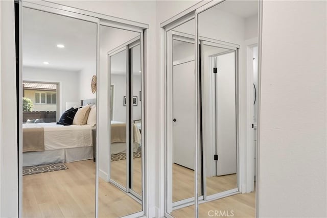 hallway with light hardwood / wood-style flooring