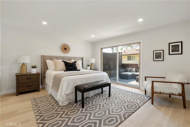 bedroom with access to exterior and light wood-type flooring