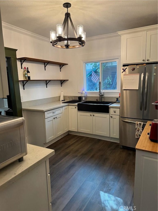 1355 N Gordon St, Pomona, CA 91768 - kitchen featuring freestanding refrigerator, a sink, crown molding, a chandelier, and open shelves