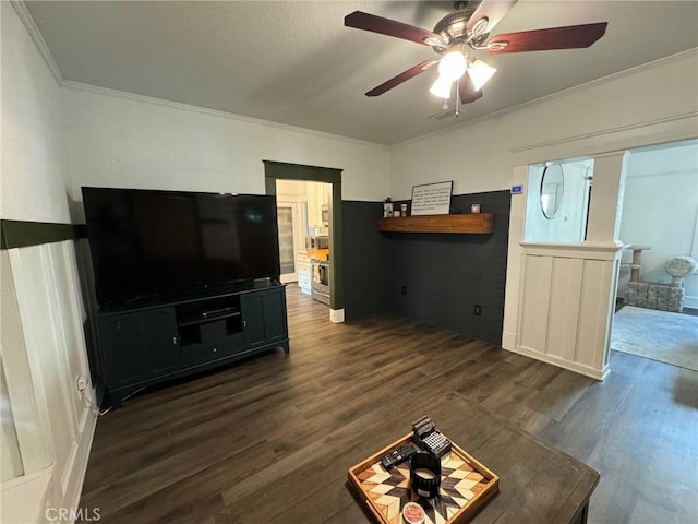 1355 N Gordon St, Pomona, CA 91768 - unfurnished living room featuring ornamental molding, dark wood-type flooring, and ceiling fan