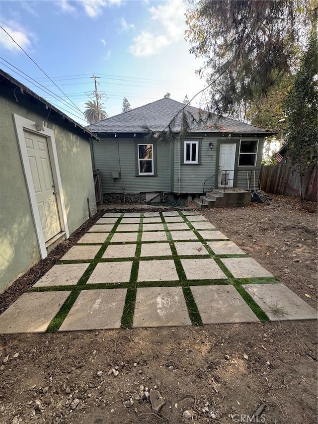 1355 N Gordon St, Pomona, CA 91768 - rear view of house with a shingled roof
