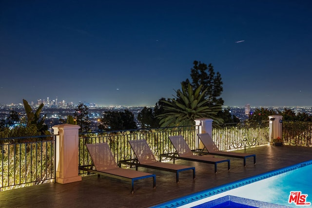 exterior space with a fenced in pool