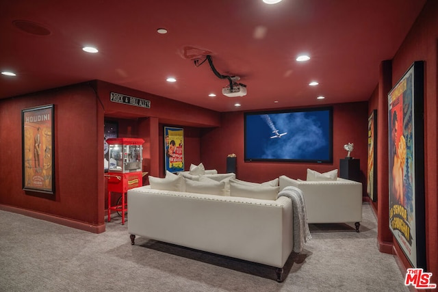 cinema room featuring light carpet