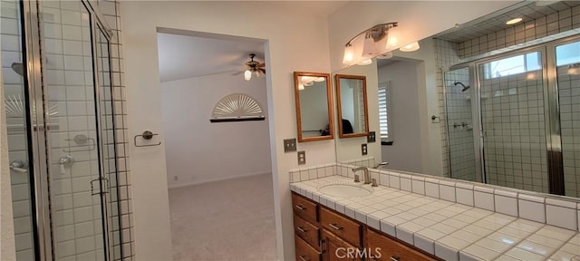 bathroom featuring an enclosed shower and vanity