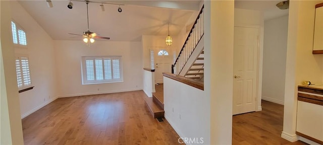 unfurnished living room with ceiling fan and light hardwood / wood-style floors