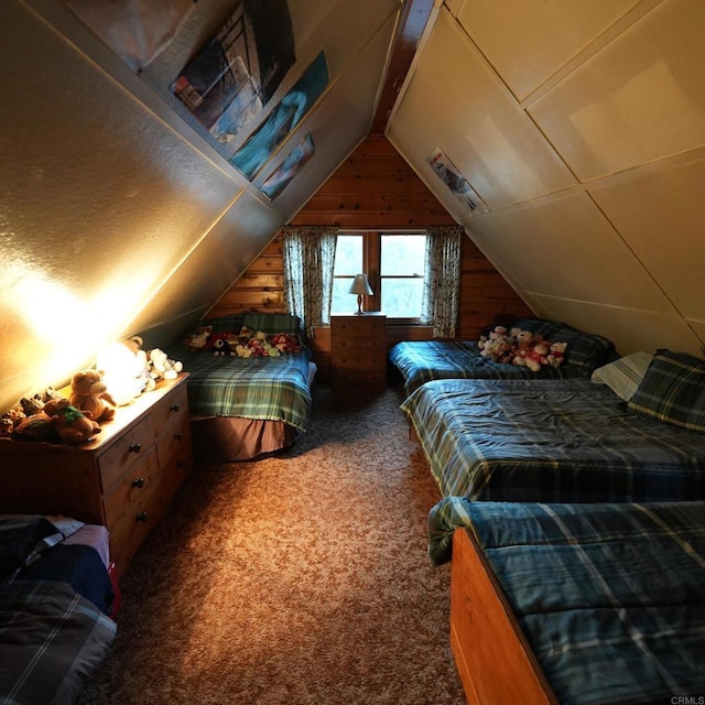 carpeted bedroom featuring wooden walls and lofted ceiling