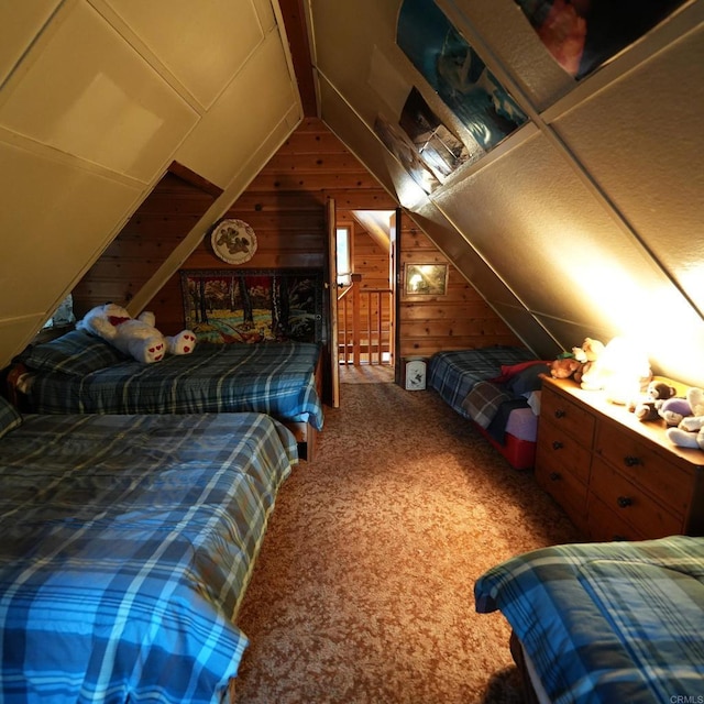 carpeted bedroom featuring lofted ceiling and wooden walls