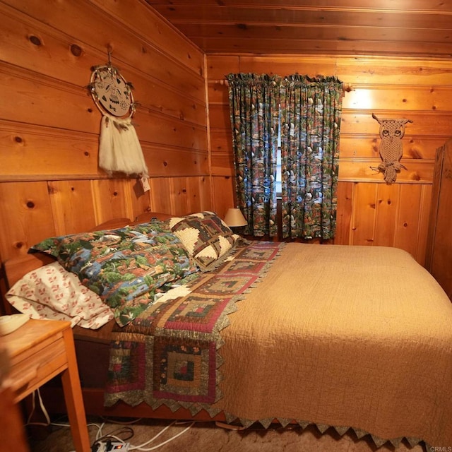 bedroom with wood walls