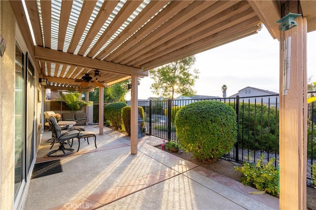 view of patio / terrace with ceiling fan and a pergola