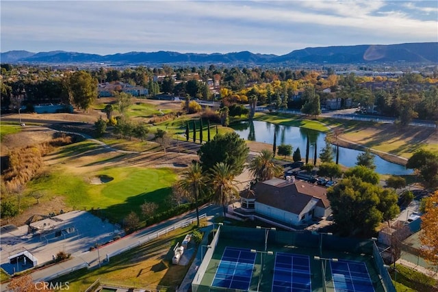 drone / aerial view with a water and mountain view