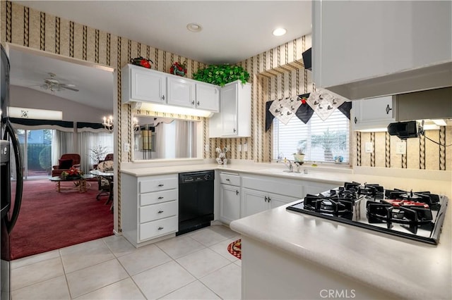 kitchen featuring black appliances, ceiling fan, light tile patterned flooring, and white cabinetry