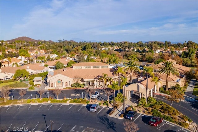 birds eye view of property with a mountain view