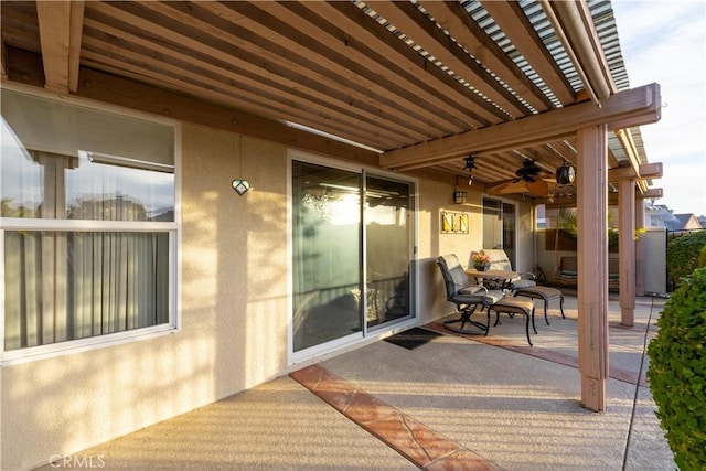 view of patio / terrace featuring ceiling fan and a pergola