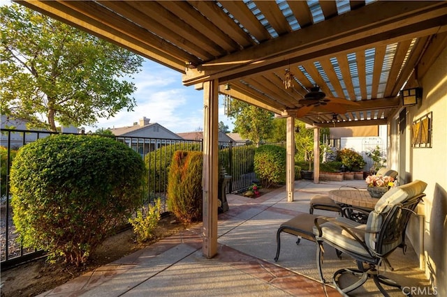 view of patio / terrace featuring ceiling fan and a pergola