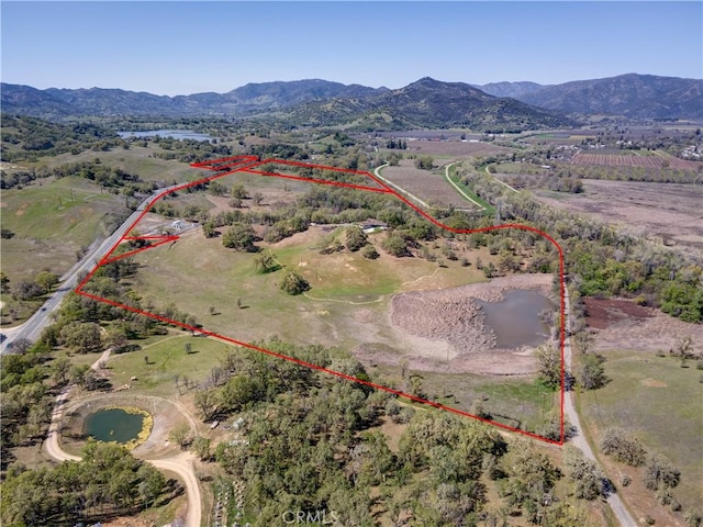 aerial view with a mountain view and a rural view