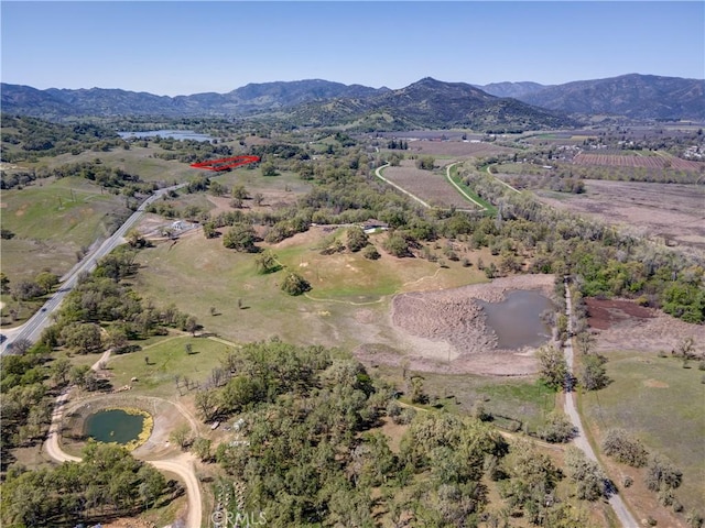 birds eye view of property featuring a mountain view and a rural view