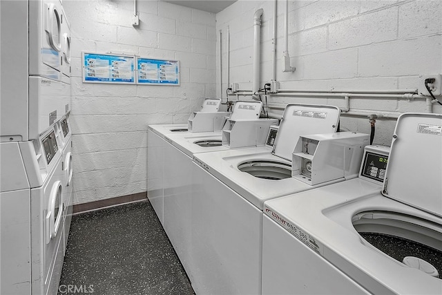 washroom featuring washer and dryer and stacked washer / dryer