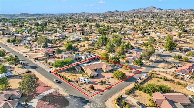 birds eye view of property with a mountain view