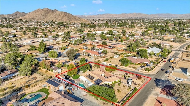 birds eye view of property with a mountain view