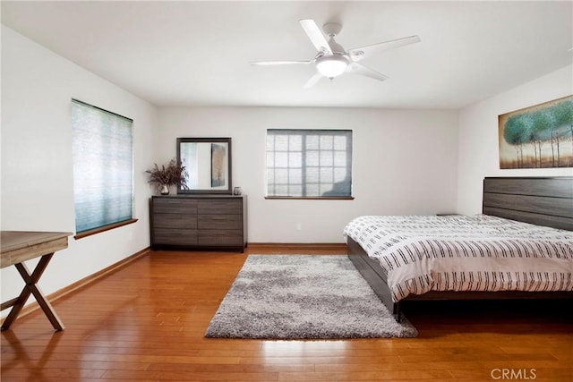 bedroom featuring hardwood / wood-style flooring and ceiling fan