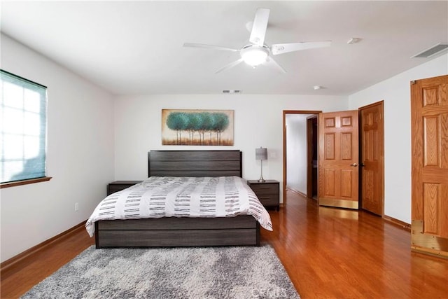 bedroom with ceiling fan and wood-type flooring