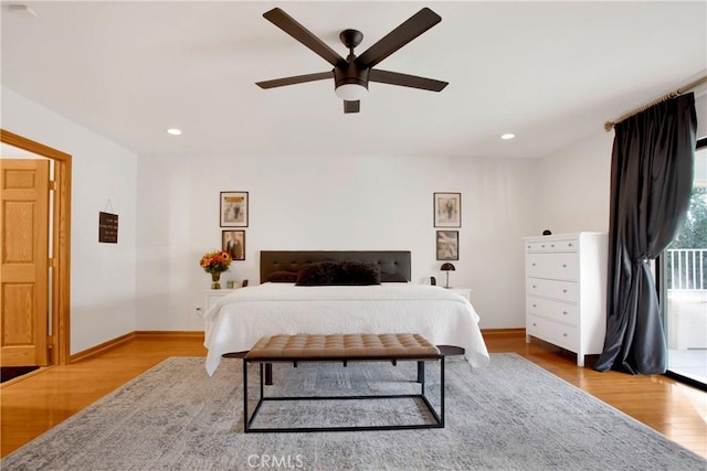 bedroom with ceiling fan and light hardwood / wood-style floors