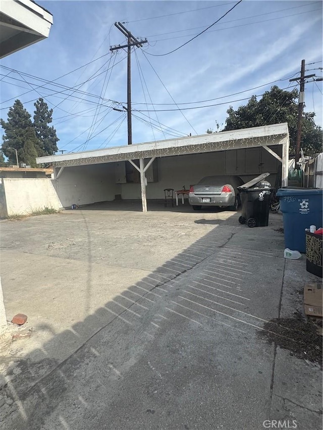 view of parking with a carport