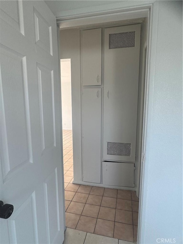 hall with light tile patterned flooring