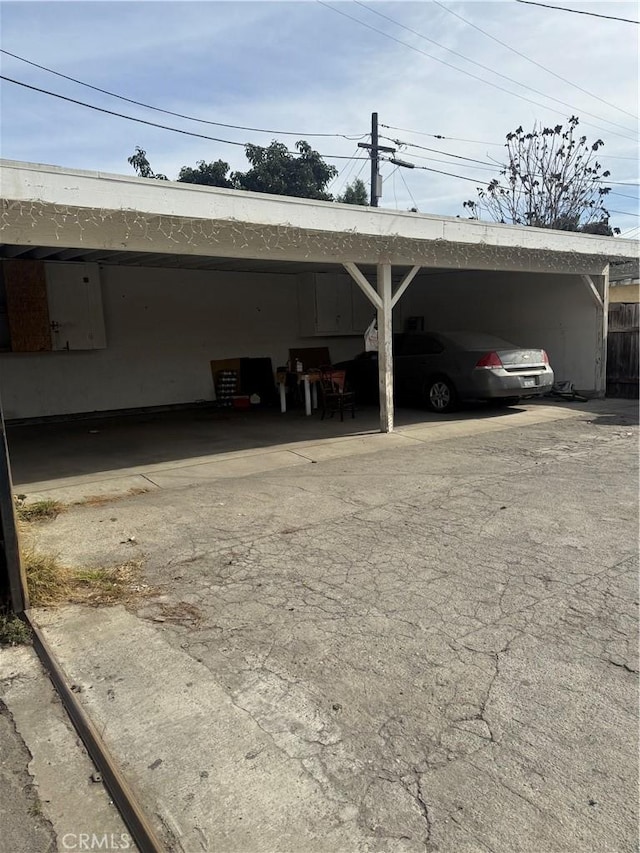 view of vehicle parking featuring a carport