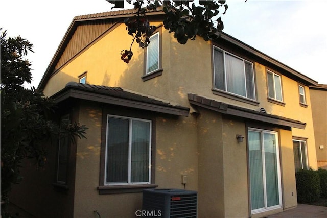 view of home's exterior featuring central AC unit