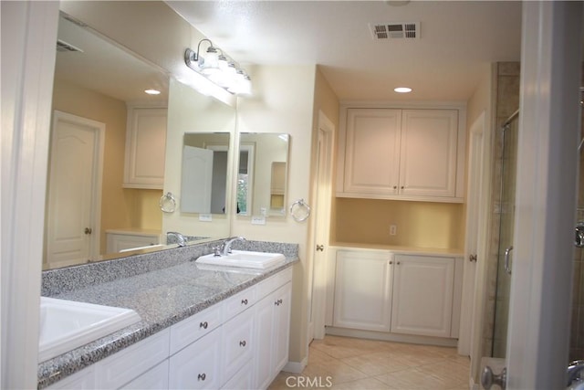 bathroom with vanity and tile patterned floors