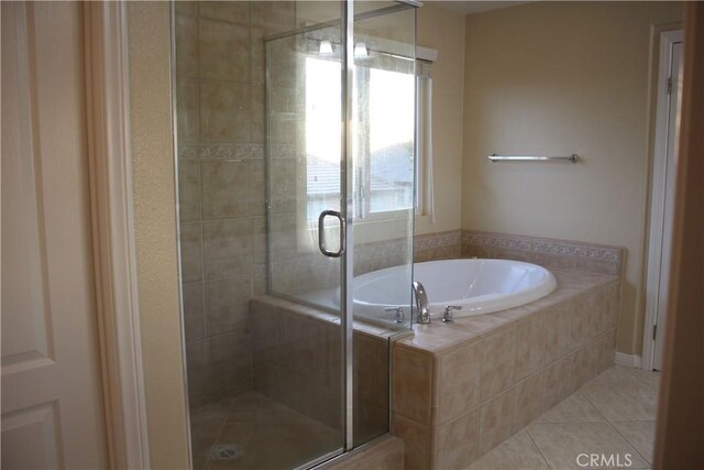 bathroom featuring separate shower and tub and tile patterned flooring